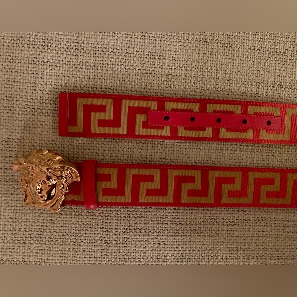 Versace red, gold-tone La Greca print Medusa head buckle belt.
